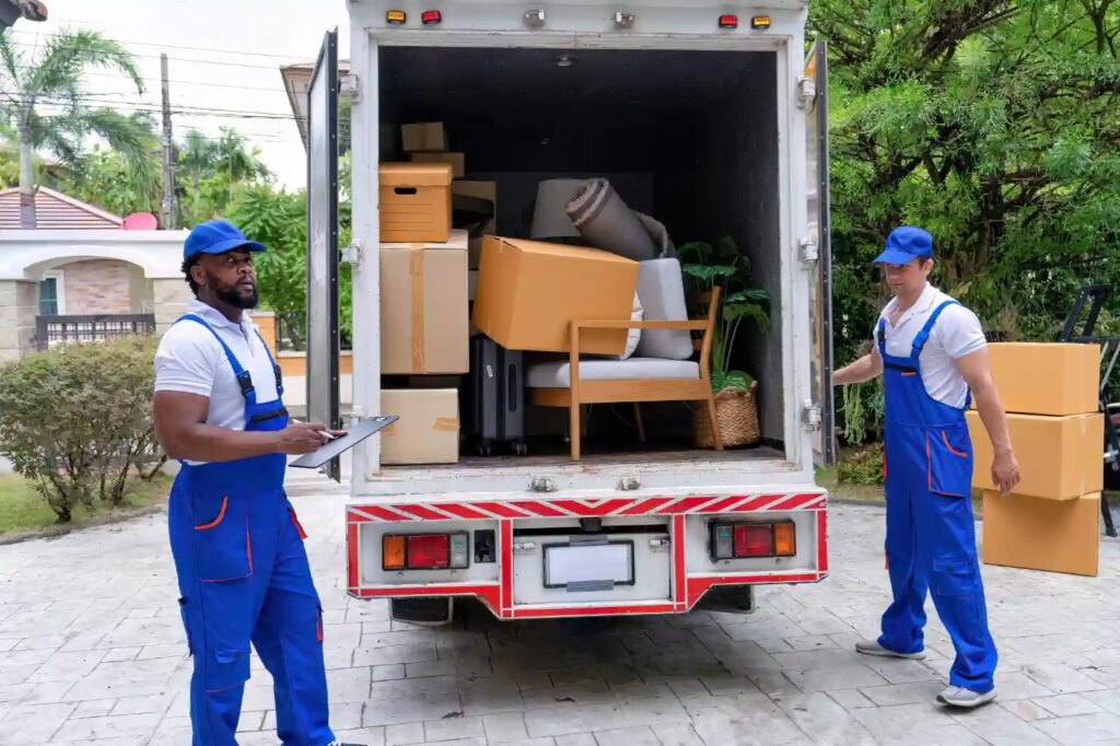 Our commercial movers in sunrise fl team carefully loading office furniture onto a moving truck.